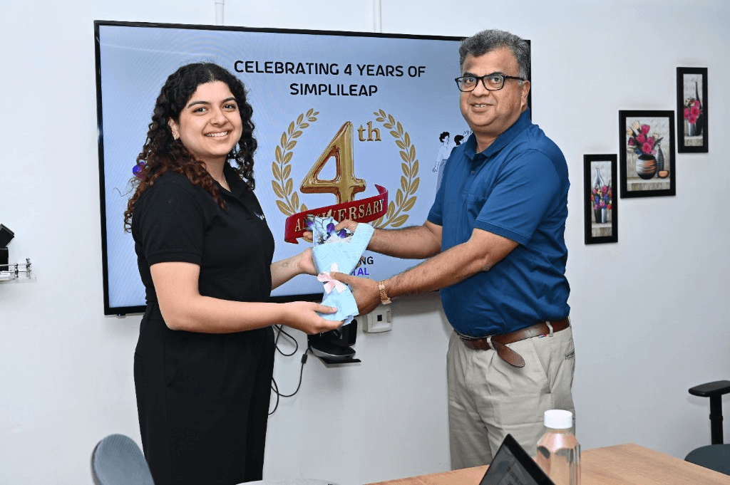 Simplileap team celebrating the company's 4th anniversary in the office